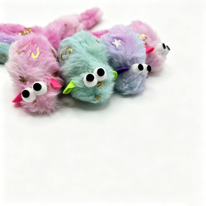 Close-up of mouse-shaped cat toys with protruding eyes and contrasting ears