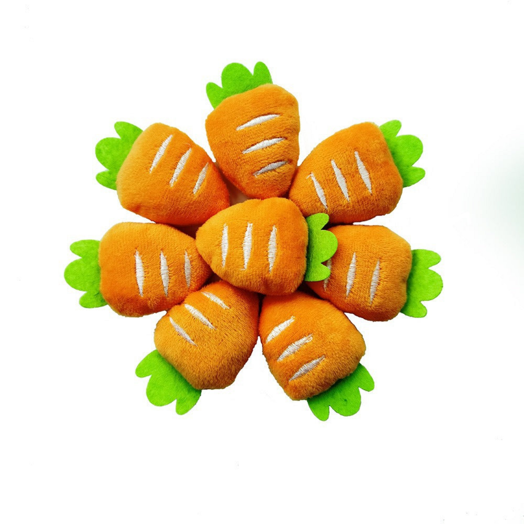 Short carrot-shaped cat toys with white stitched stripes and green tops grouped together