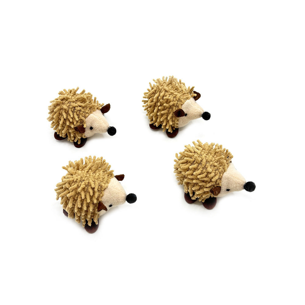 Hedgehog cat toys viewed from the side, showing brown ears and feet