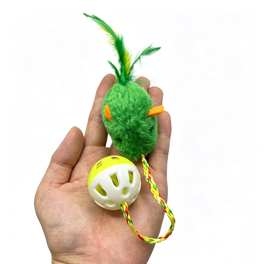 Green mouse-shaped cat toy held in a hand, showing its feather tail, braided cord and perforated ball