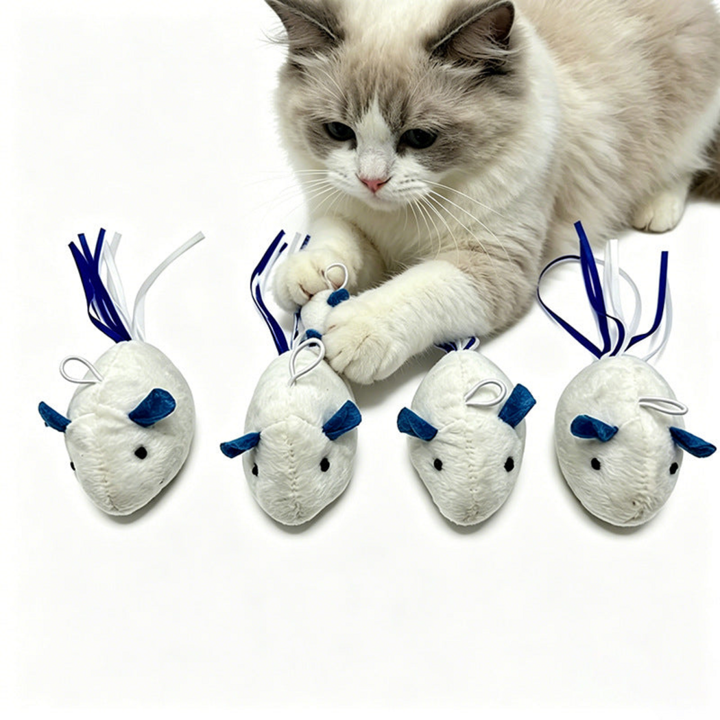 Cat reaching toward white mouse-shaped cat toys with blue ears and ribbon tails