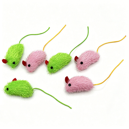 Green and pink mouse-shaped cat toys viewed from above, with long cord tails
