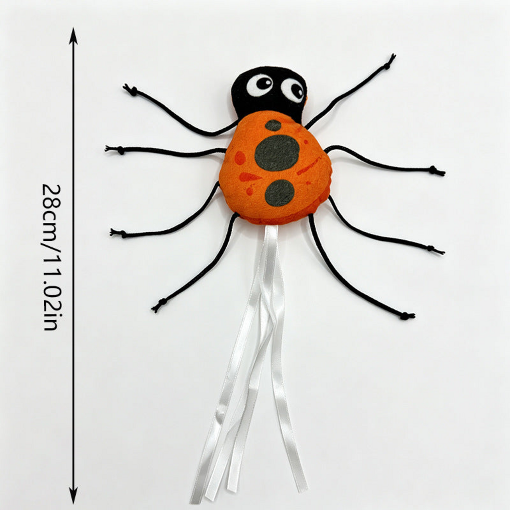 Ladybug cat toy with cord legs, white ribbons and metric and imperial measurement information