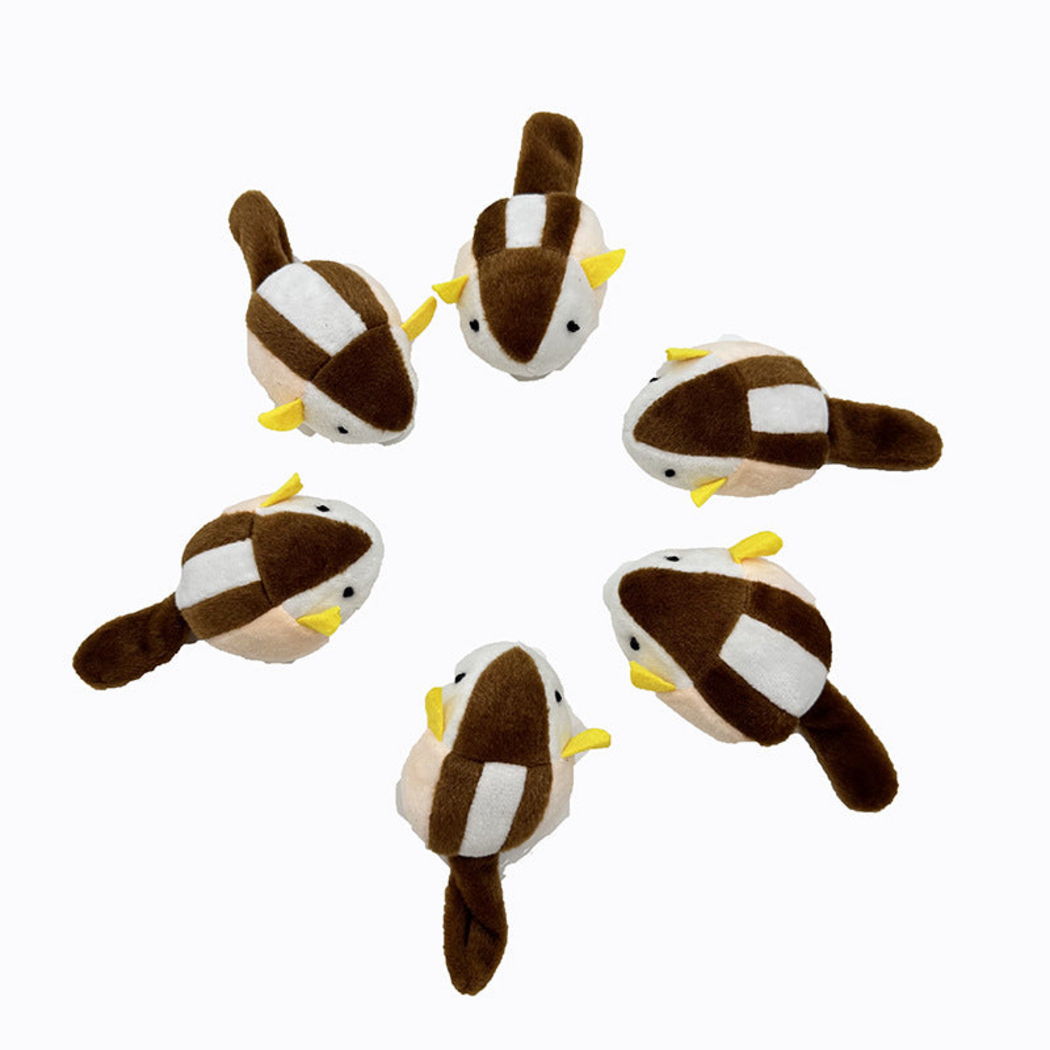 Squirrel-shaped cat toys viewed from above, showing white back stripes and brown tails