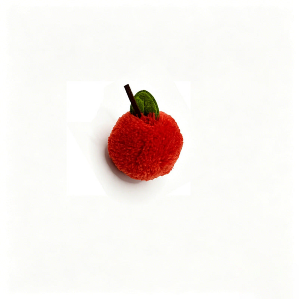 Orange Red Orange ball cat toy with a dark stem and green leaf