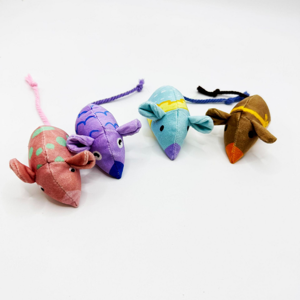 Pink, Purple, Blue and Brown mouse-shaped cat toys arranged diagonally with cord tails