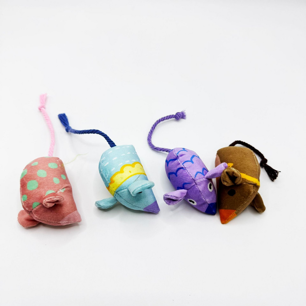 Overhead view of Pink, Blue, Purple and Brown mouse-shaped cat toys with patterned backs and cord tails