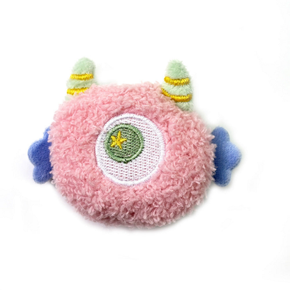 Pink cat toy with a central embroidered eye and blue side appendages