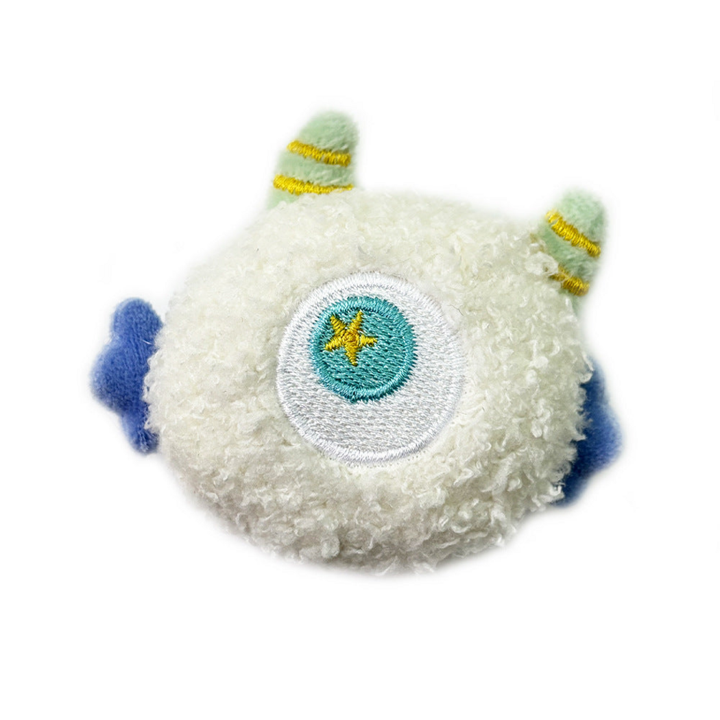 White cat toy with a central embroidered eye and blue side appendages