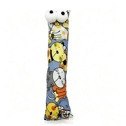 Yellow pillow cat toy with colorful cartoon cats and two protruding white eyes