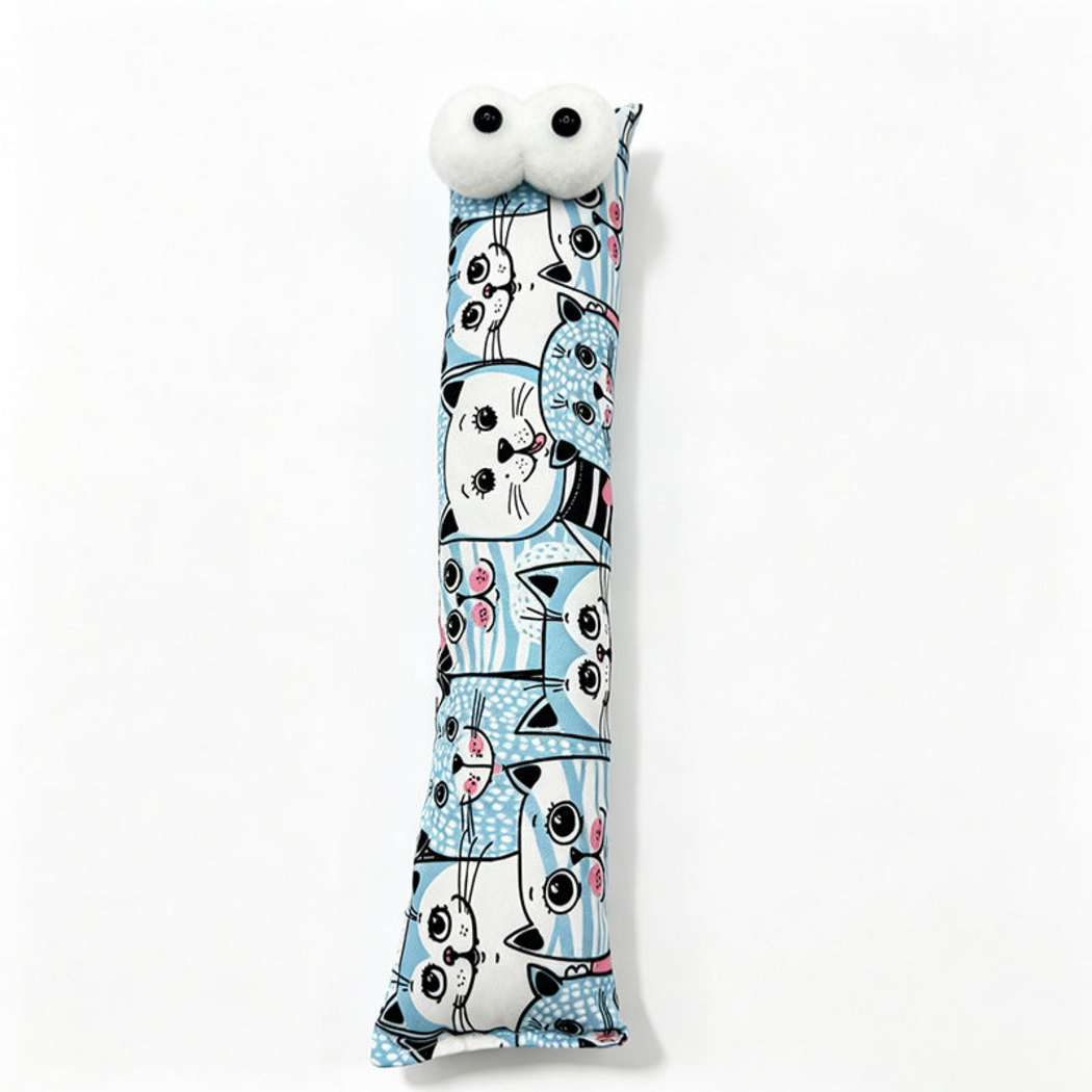 Blue pillow cat toy with white cartoon cat faces, pink details and two white eyes
