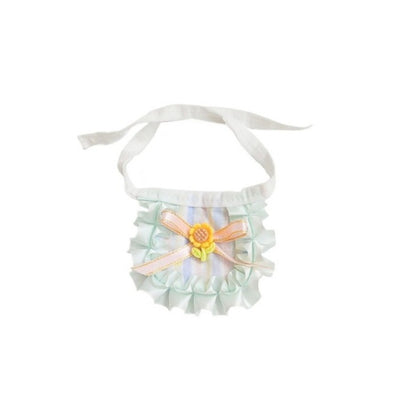 Pastel ribbon cat bib folded neatly showing ribbon pattern and fabric quality