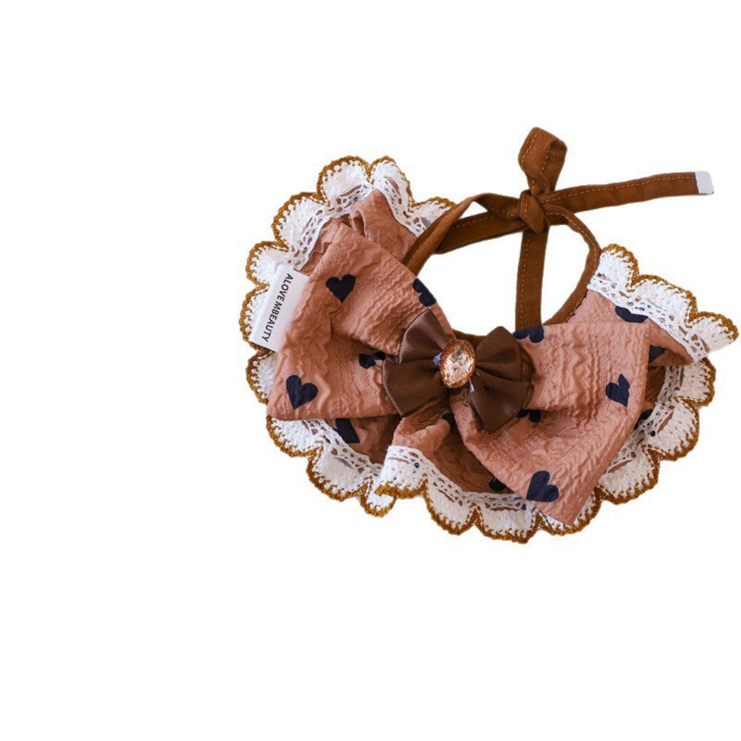 Hearts Pet Neckwear with brown ties, a layered bow and scalloped edging on white