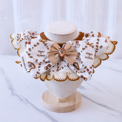 Animals Pet Neckwear with a beige bow and scalloped white edging, front view on a stand