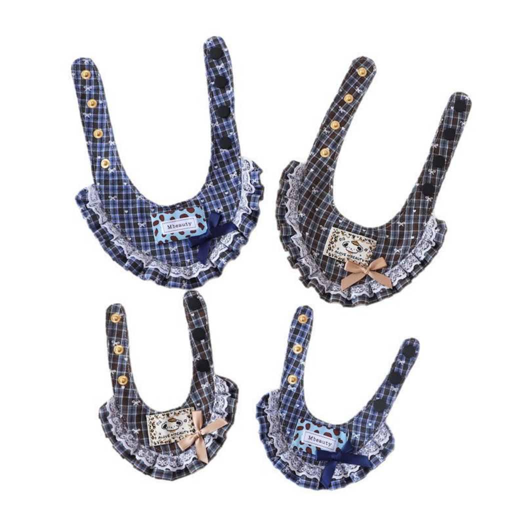 Blue and Brown plaid Pet Neckwear laid open to show long straps and multiple snap positions