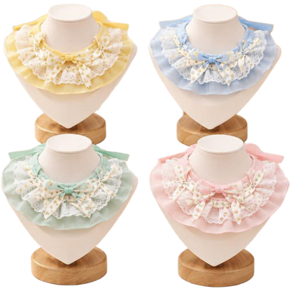 Yellow, Blue, Mint and Pink Pet Neckwear displayed on stands, showing layered ruffles and bows