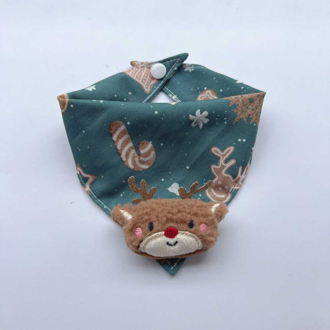 Reindeer pet neckwear with teal blue patterned bandana, white snap and raised brown reindeer face charm