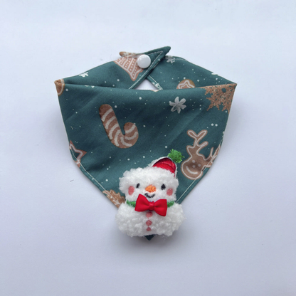 Snowman pet neckwear with teal blue patterned bandana, white snap and raised snowman charm with red bow
