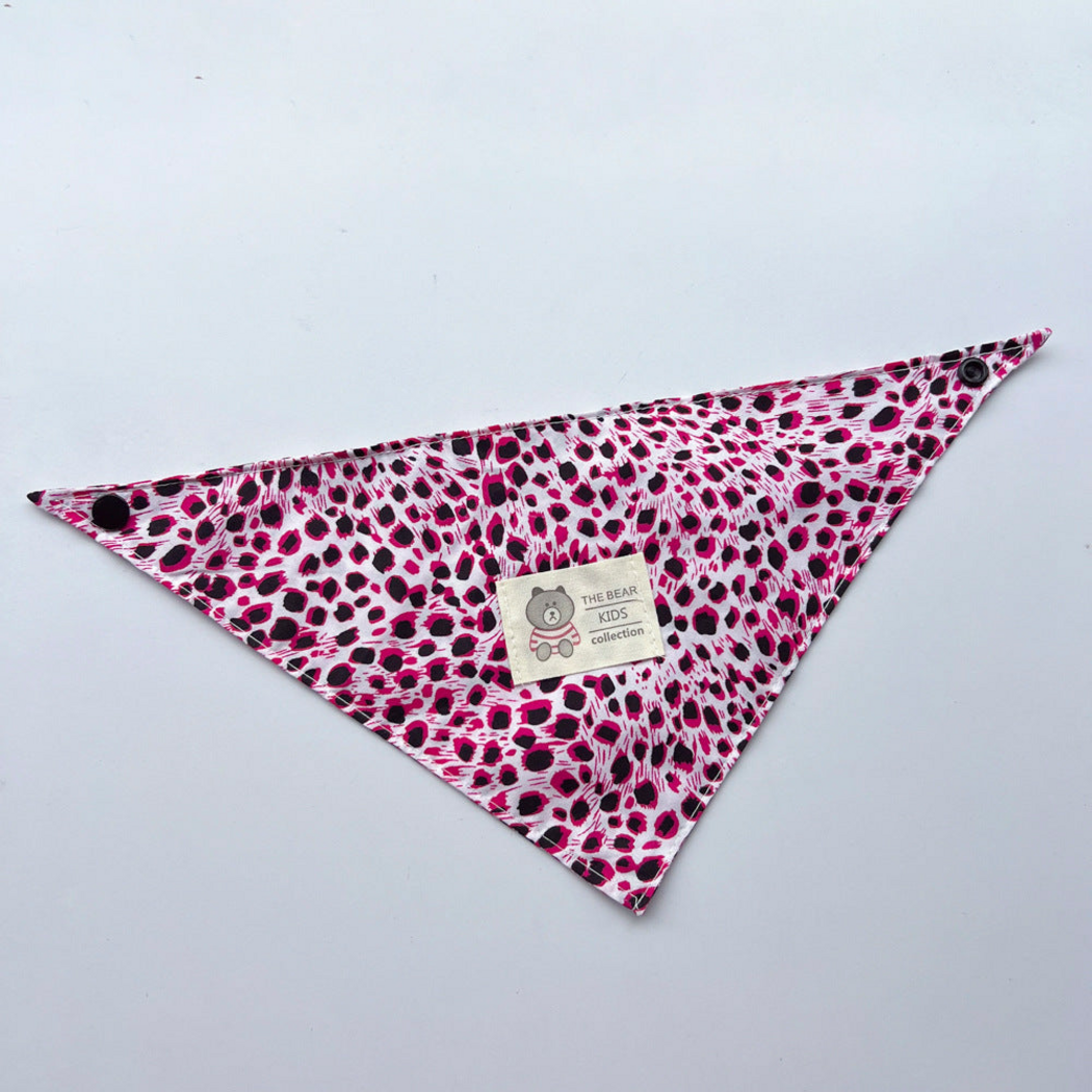 Pink leopard-print triangular pet neckwear laid flat with corner snaps and bear label