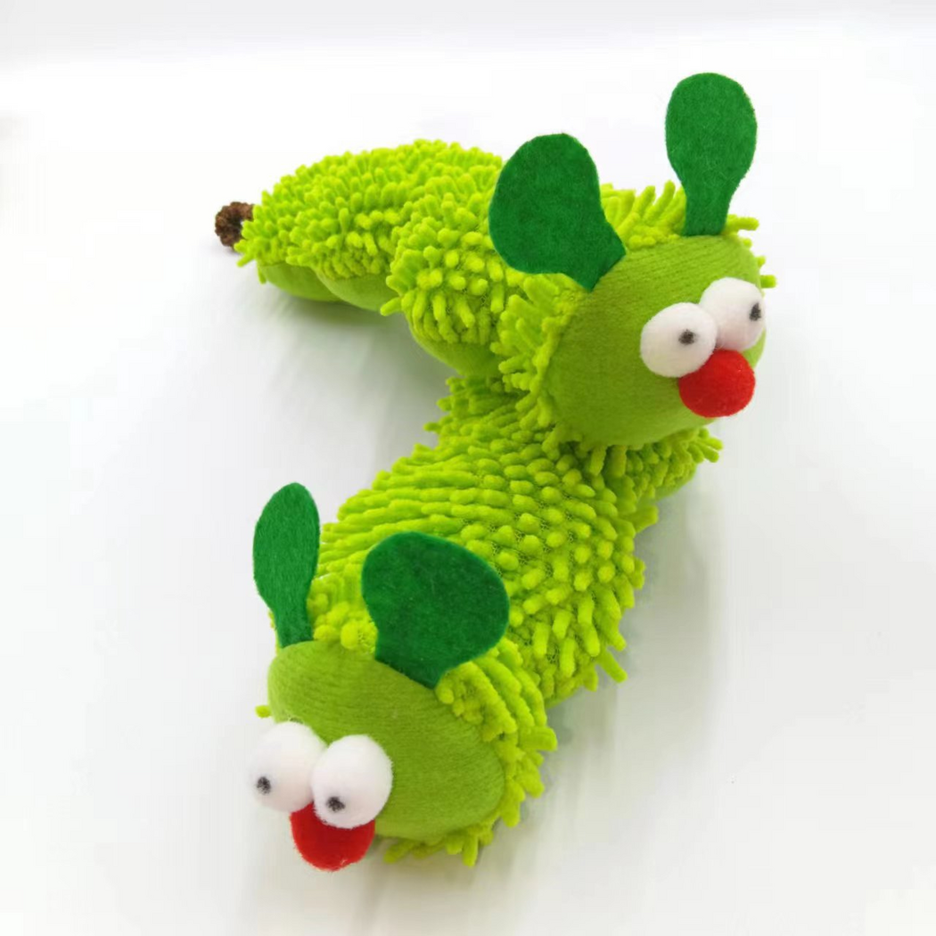 Two bright green caterpillar-shaped cat toys arranged diagonally, showing tufted bodies and character faces