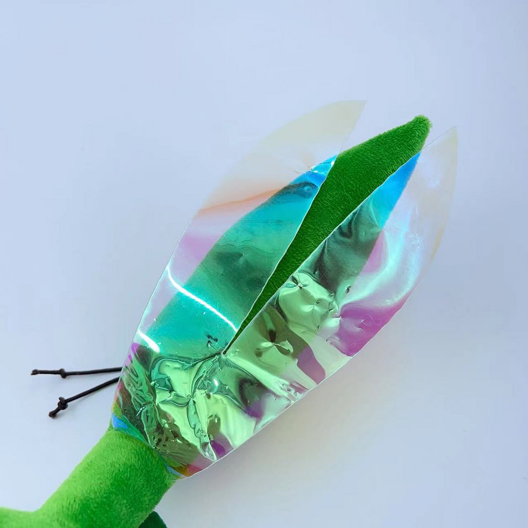 Close-up of the Mantis cat toy's translucent iridescent wings and tapered green back