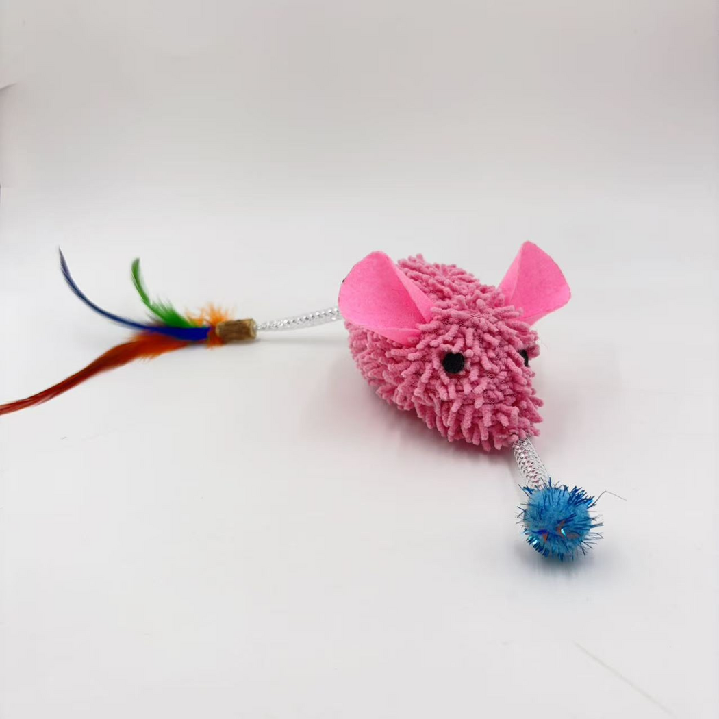 Pink mouse-shaped cat toy in three-quarter view with blue tuft and partially cropped feather attachment