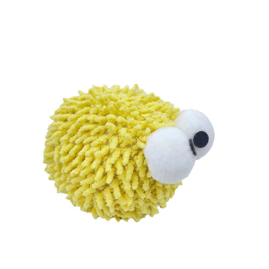 Yellow ball cat toy with large white eyes, three-quarter view