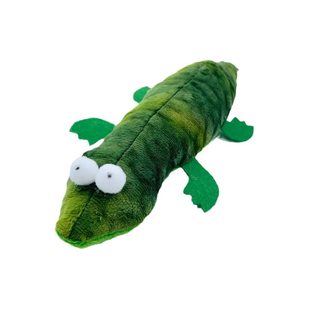 Crocodile cat toy with green patches, raised white eyes and four flat legs, angled view