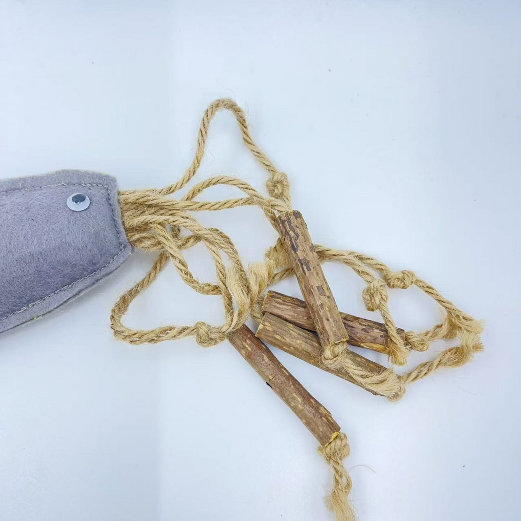 Close-up of tan knotted cords and brown sticks attached to the cat toy body