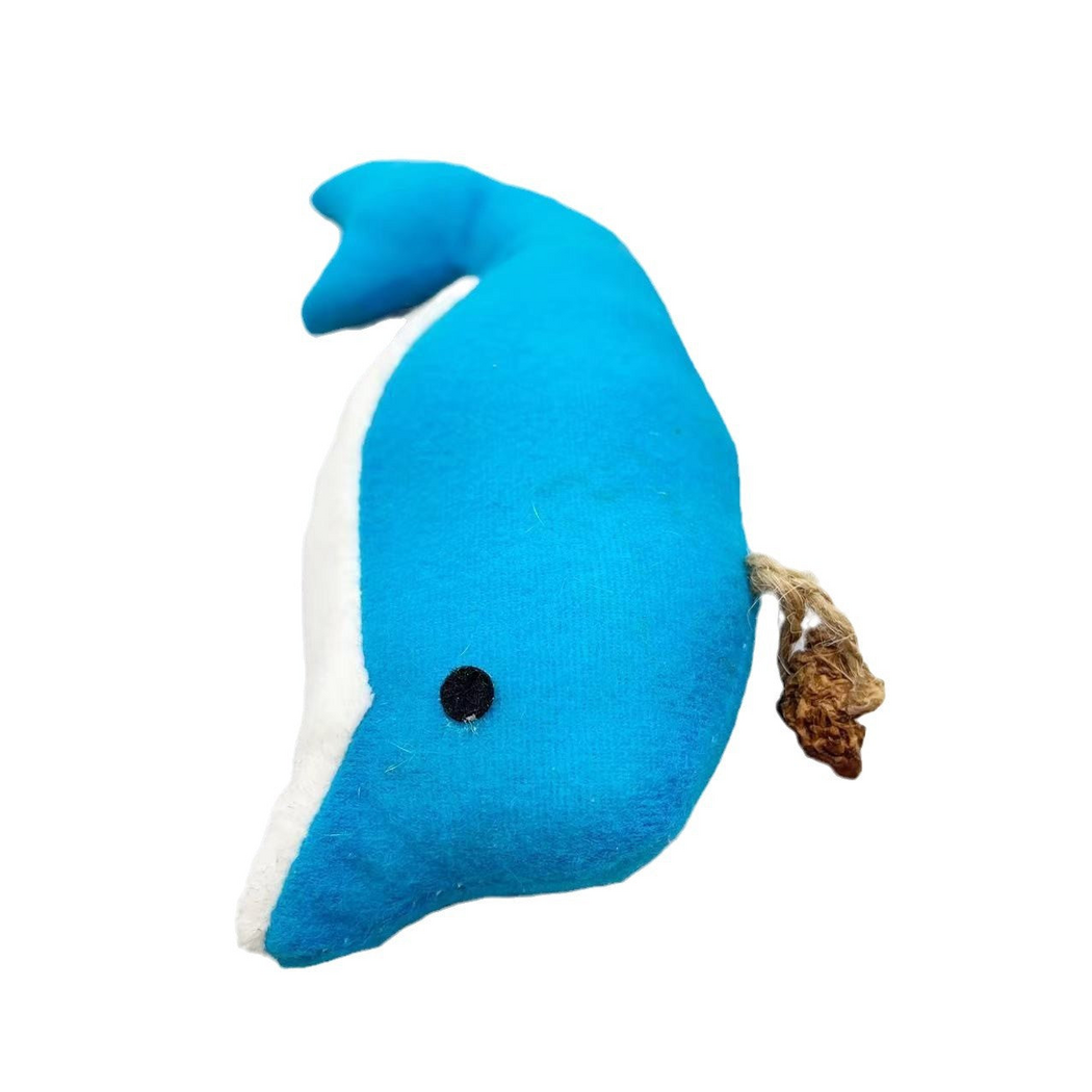 Dolphin cat toy at an angle, showing its black eye, white underside and cord-secured brown attachment