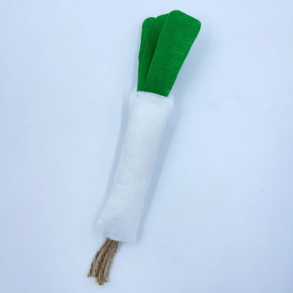 Scallion-shaped cat toy, rear view showing the white body, green leaves and tan cord tassel