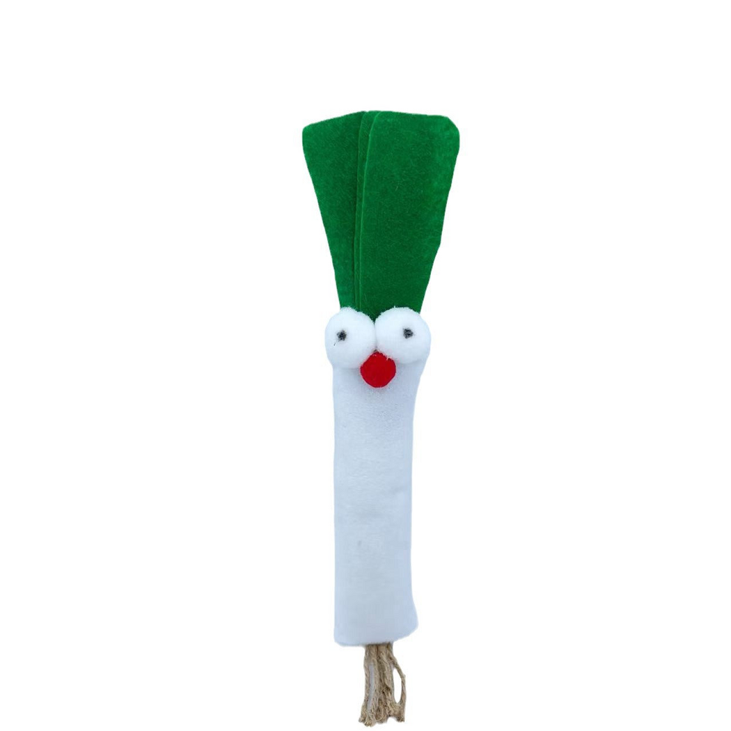 Scallion cat toy with green leaves, a white body, round eyes, a red nose and tan cord tassel, front view