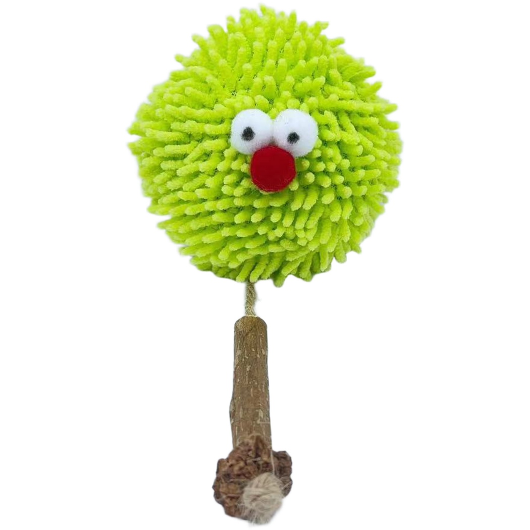 Ball cat toy with green tufts, white eyes, a red nose and a trailing cord with brown sections