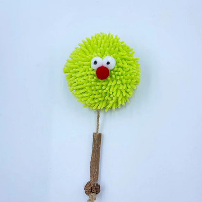 Front view of the green Ball cat toy with its cord and narrow brown section extended below