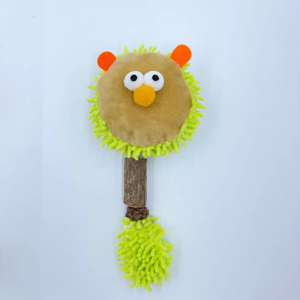 Green lion-face cat toy with orange ears, yellow nose, bark-textured cylinder and fringed tail, front view