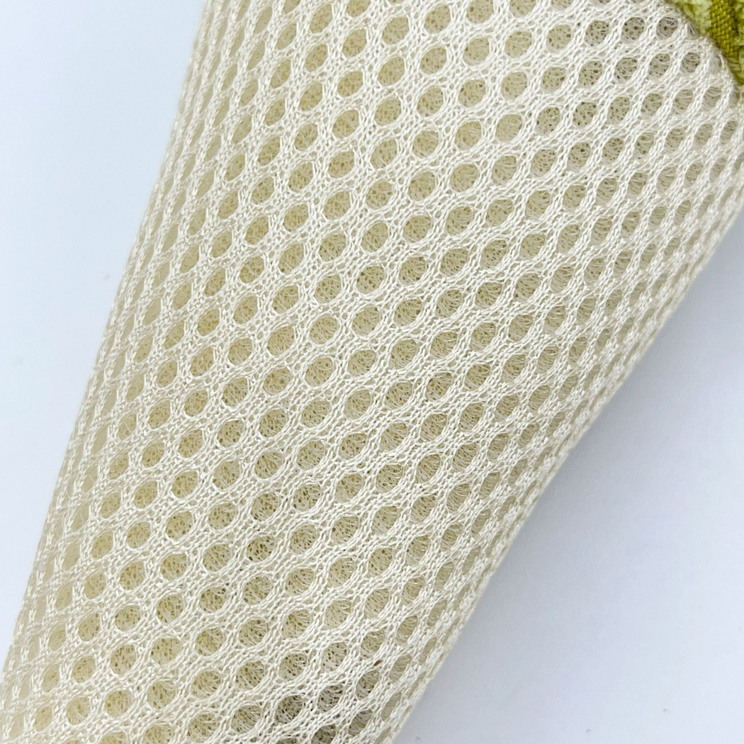 Close-up of the cat toy's cream open mesh cone surface