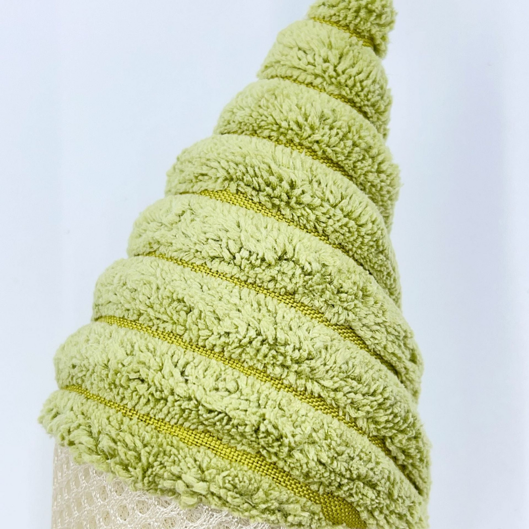 Close-up of raised green spiral ridges and narrow bands on the cat toy