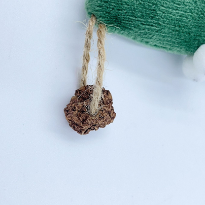 Close-up of the brown textured ball and tan cord loop attached to the cat toy