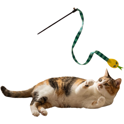 Cat reaching toward a green striped snake wand toy with a yellow head