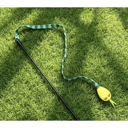 Green cat teaser toy detail; lower rod or rope end cropped