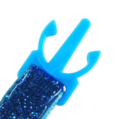 Close-up of the open collar buckle prongs and glittery strap
