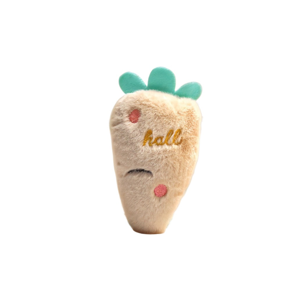Petkin Carrot Plush Squeaky Dog Toy held in hand for size reference