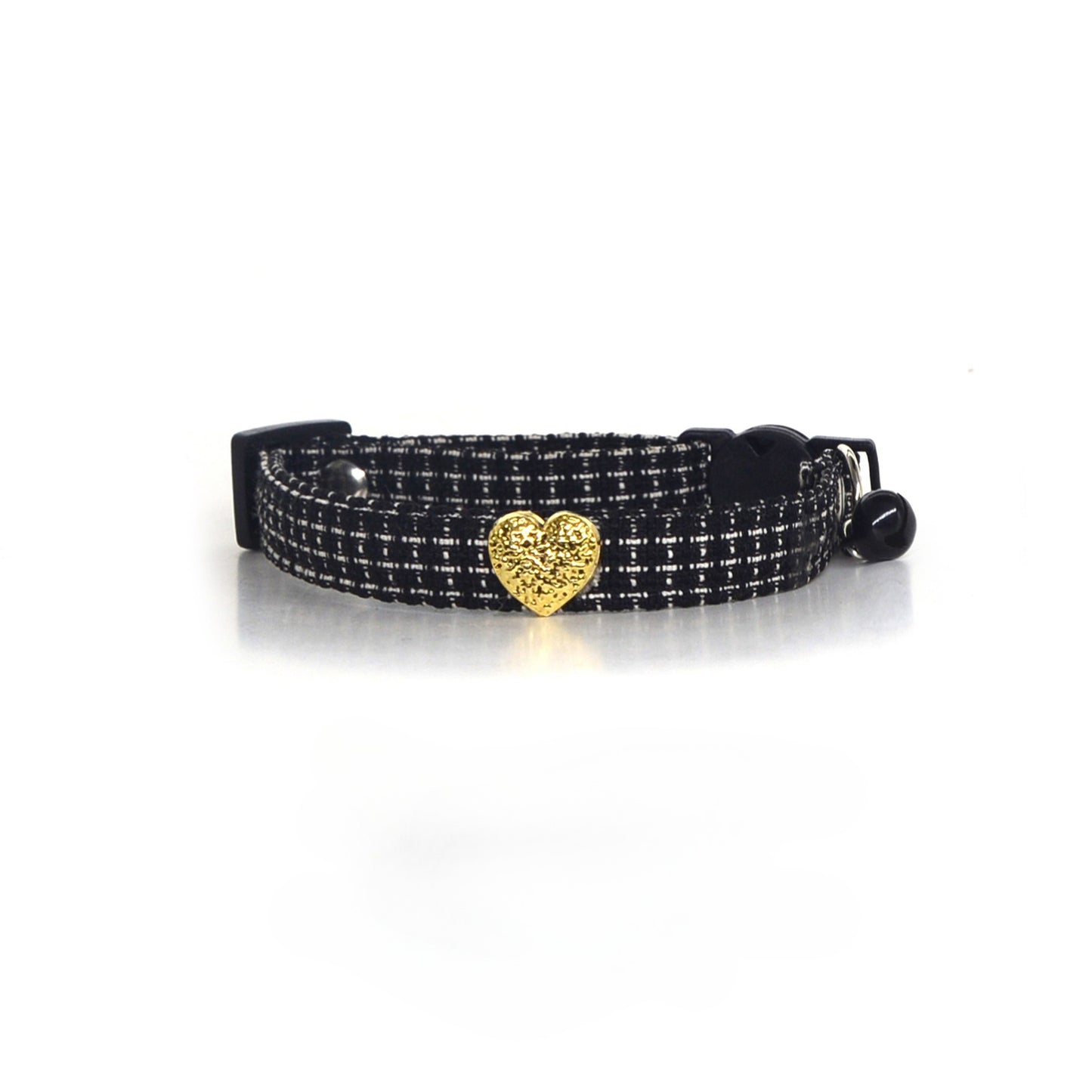 Cat wearing Mokka tweed heart collar with heart charm visible on neck