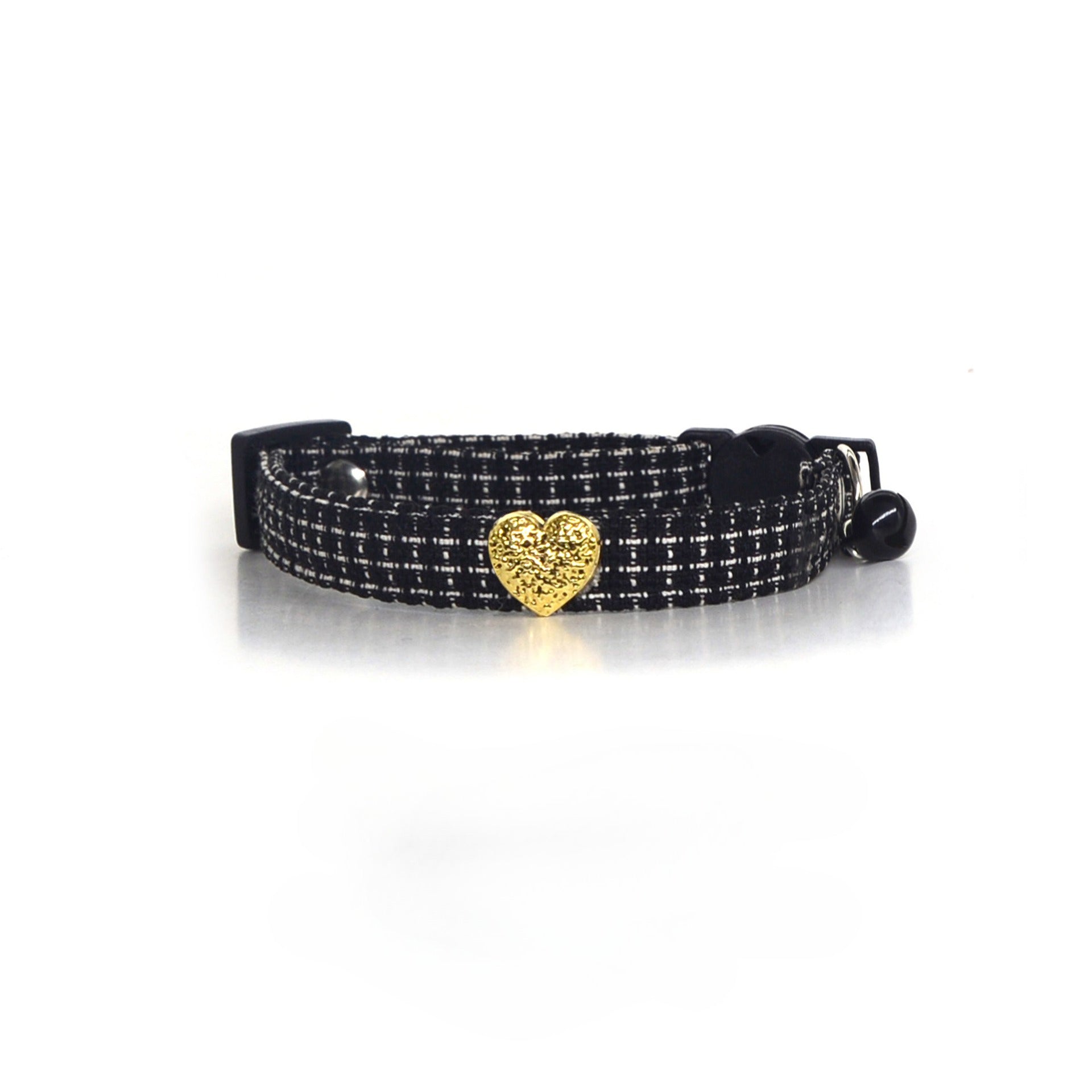 Cat wearing Mokka tweed heart collar with heart charm visible on neck