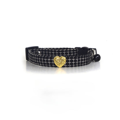 Cat wearing Mokka tweed heart collar with heart charm visible on neck