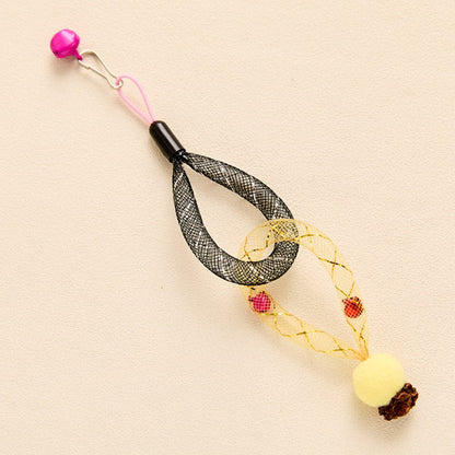 Close-up of Moo mesh tube cat toy showing bell inside