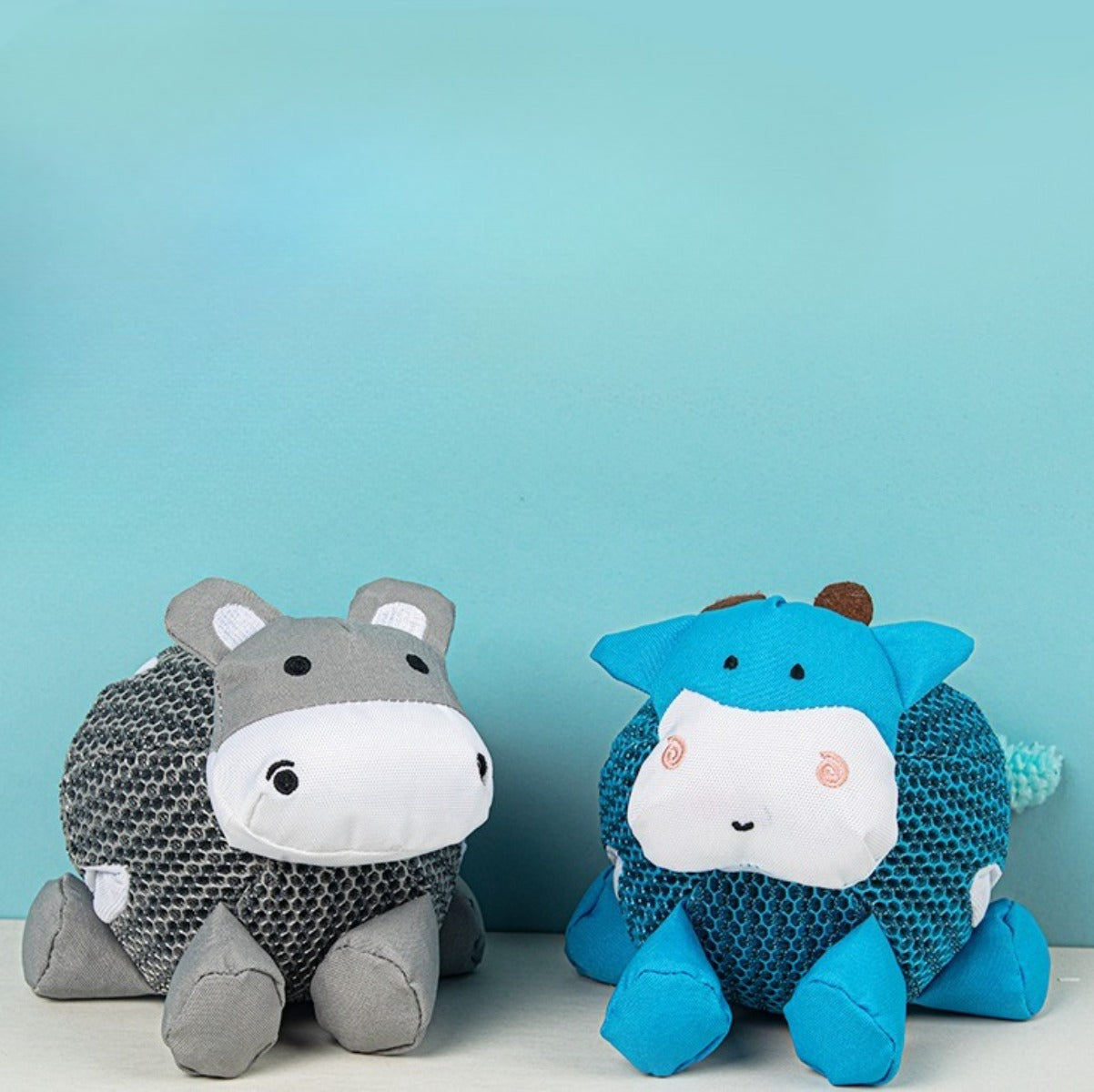 Petkin soft flat dog toy displayed with other pet toys for size comparison