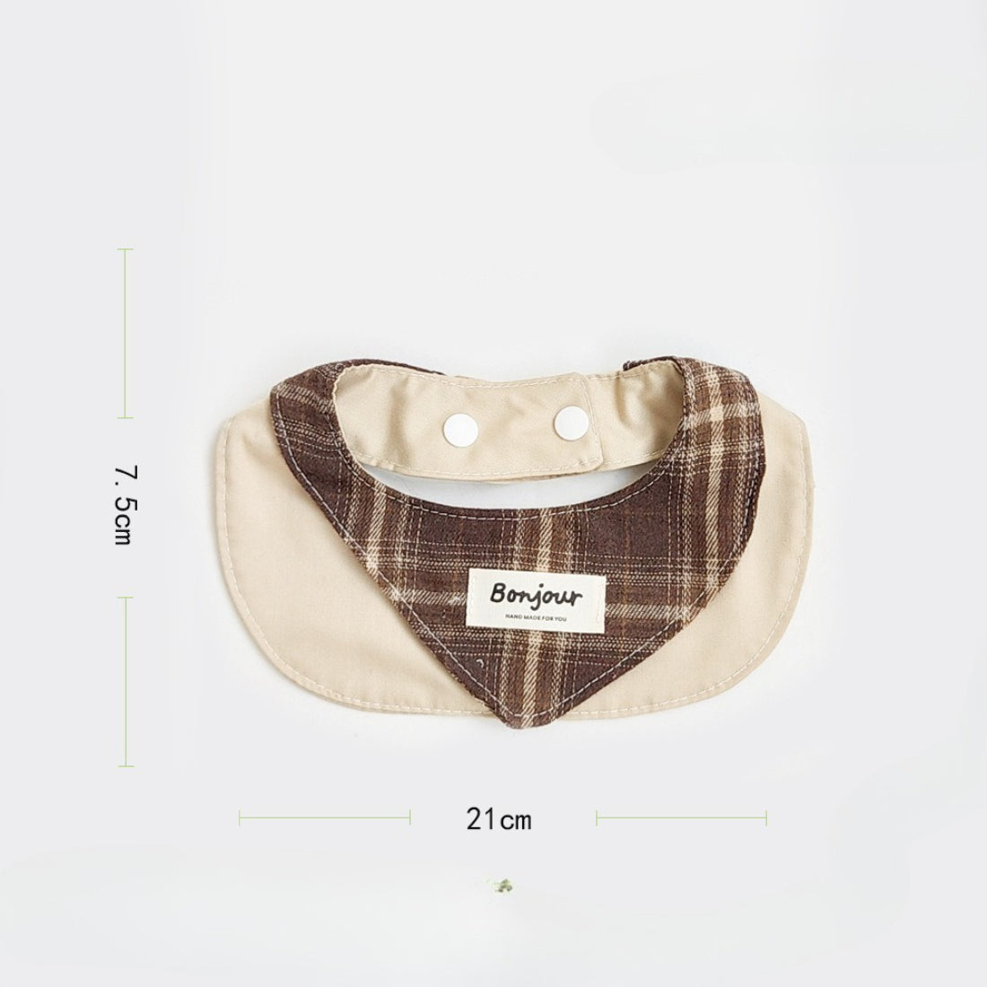Close-up of brown ruffle detail on cat bib fabric