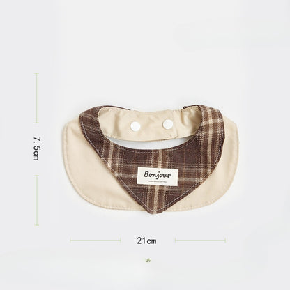 Close-up of brown ruffle detail on cat bib fabric