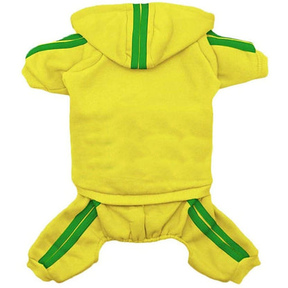 Small dog wearing Ozzie hooded jumpsuit standing on white background